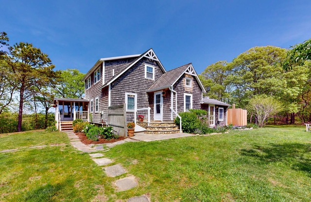 Historic, coastal home with water views, screened-in porch, large deck, & grill