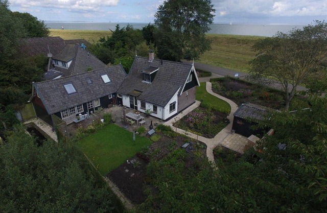 historic cottage in scenic Dutch landscape at IJsselmeer