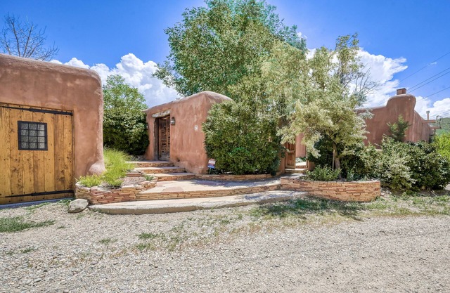 Historic dog-friendly hacienda with 2 casitas, fireplaces, on-site hot tub, yoga