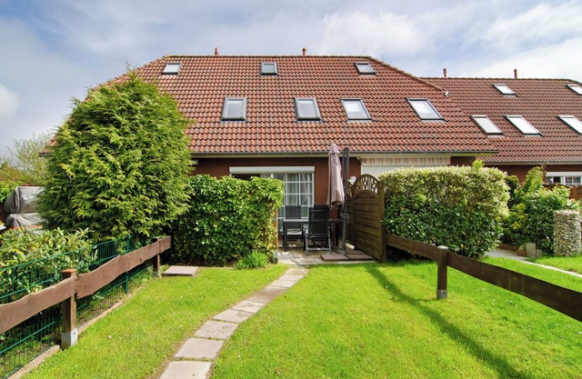 Ferienwohnung 'Ferienhaus Deichblick Nessmersiel' mit privater Terrasse, privatem Garten und WLAN