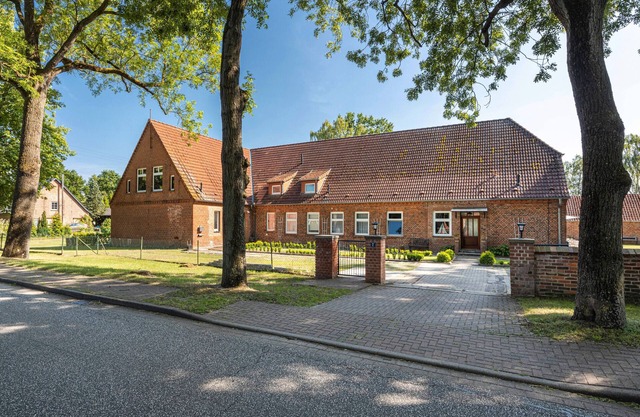 Ferienwohnung 'Landhaus Heiddorf' mit Terrasse, Garten mit Sonnenliegen und schnellem Internet