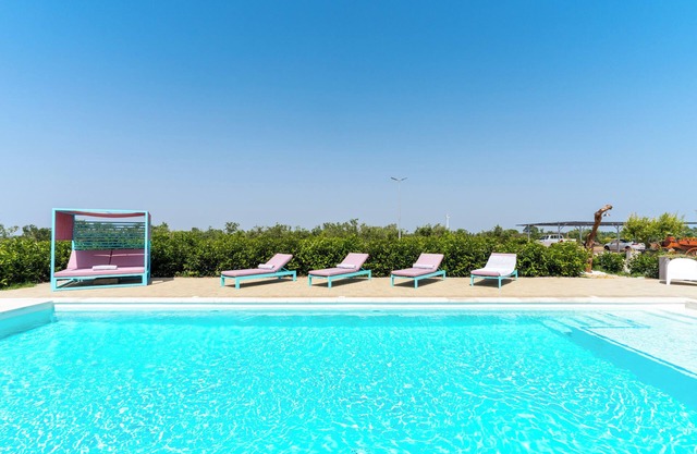 Ferienwohnung "Le Scuderie 4" mit Gemeinschaftspool, gemeinsamer Terrasse und WLAN