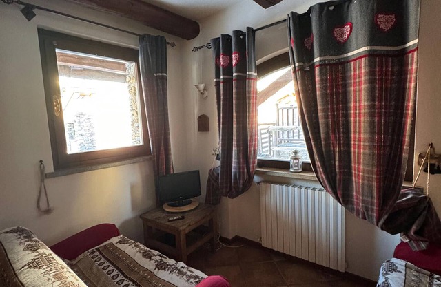Ferienhaus 'Baita Plagnol Sestriere Ski Slopes' mit Bergblick und Balkon