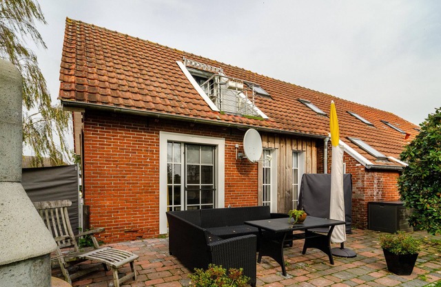 Ferienhaus "Huus Ant Kornfeld Erdgeschoss" mit Gemeinschaftsgarten und WLAN