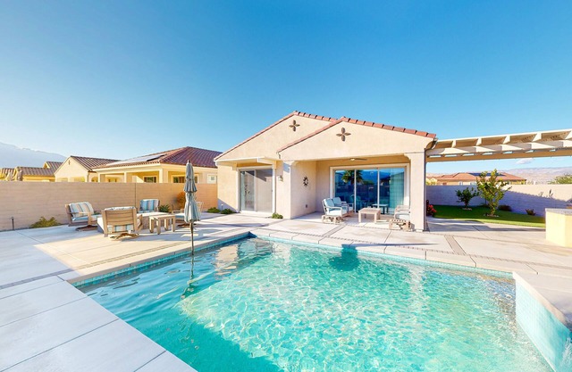 Home in a 55+ gated community with a private pool, grill, & furnished lanai