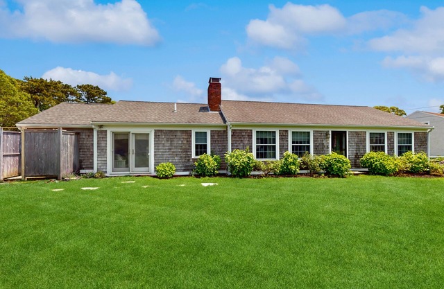 Home near beach & tennis/basketball court with firepit, grill, & patio