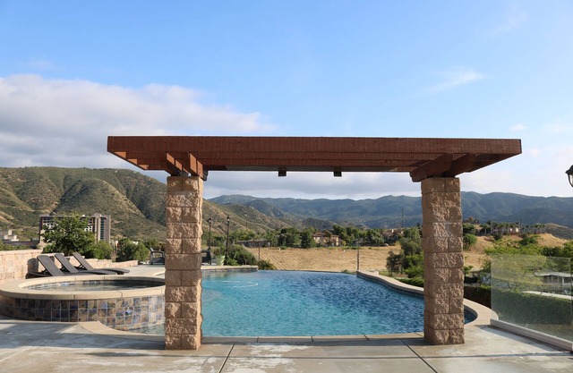 Home with infinity pool, hot tub, and mountain views. Pet-Friendly!