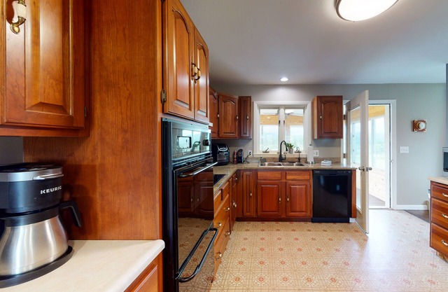 Dog-friendly home with mountain view, large yard, fire pit, & 3-season room