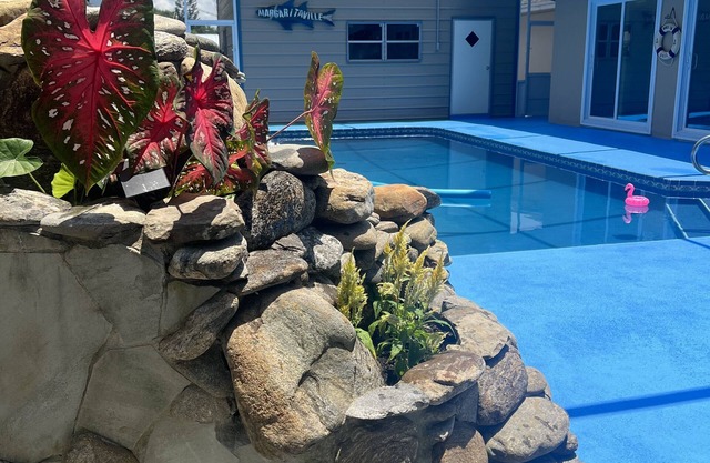 Home with play room, enclosed pool and hot tub. Only 10 minutes from the beach!