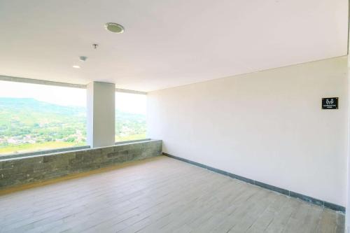 Homey and Restful Studio Royal Sentul Park Apartment By Travelio