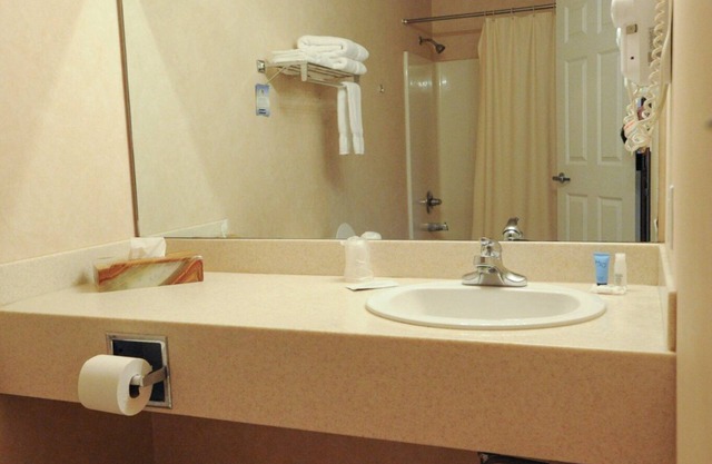 Hotel room with TWO QUEEN BEDS and attached, private bathroom.