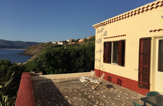 Haus mit Garten auf dem Meer, Strand unten