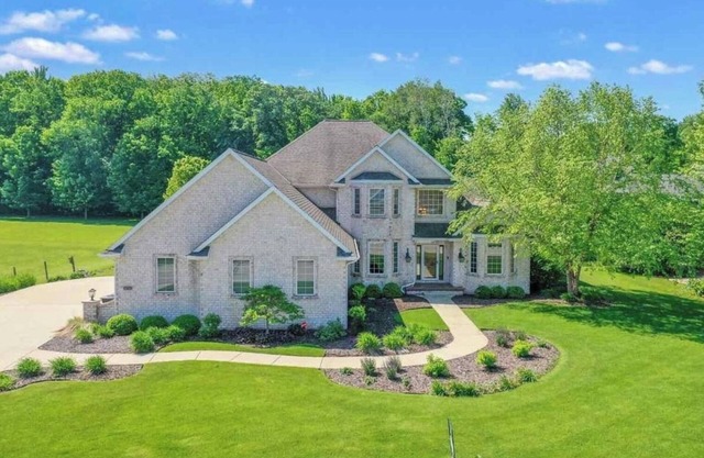 Huge home with theater, hot tub, golf cart, and just minutes from Lambeau Field!