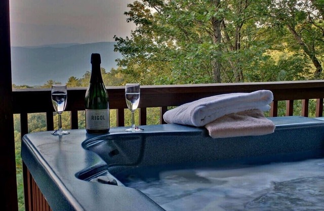 Hummingbird Haven is the ultimate retreat for large groups! Enjoy pet-friendly accommodations, breathtaking mountain views, a hot tub, firepit, WiFi, and hiking