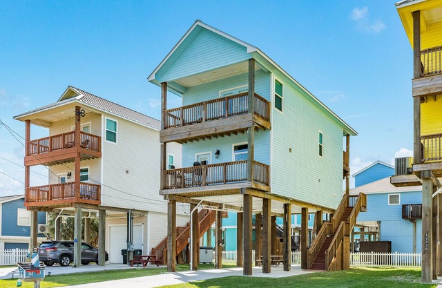 Idyllic beach abode with multiple balconies, outdoor shower, & easy beach access