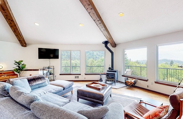 Idyllic home with water views, wrap-around deck, hot tub, and firepit - dogs ok