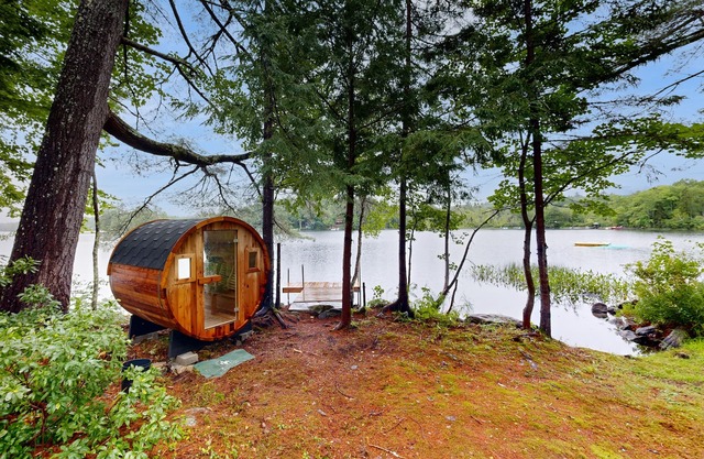 Idyllic lakeside house with outdoor sauna, patio and firepit