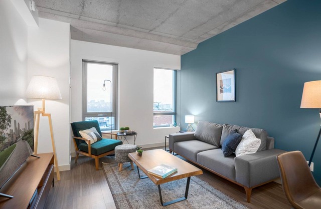 Industrial 1BR near MIT w/ Gym, Doorman, Roof Deck
