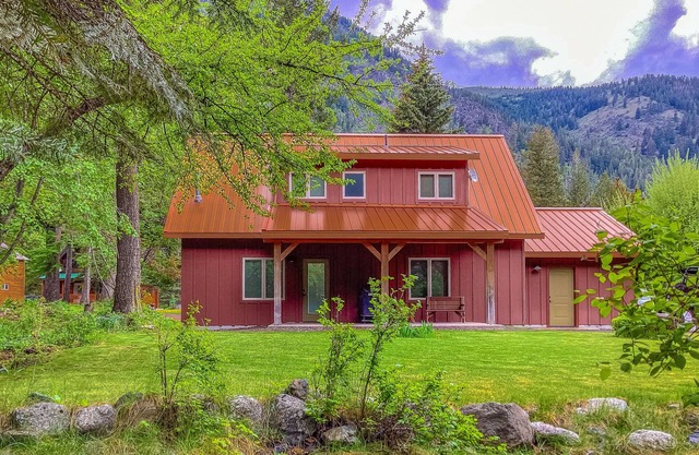 Inviting riverfront home with fireplace, mountain view & W/D - dog-friendly