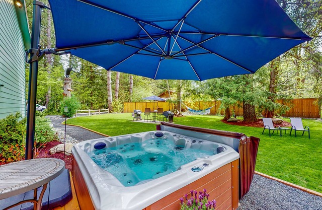 Inviting riverfront home with hot tub, firepit, W/D, & dog-friendly