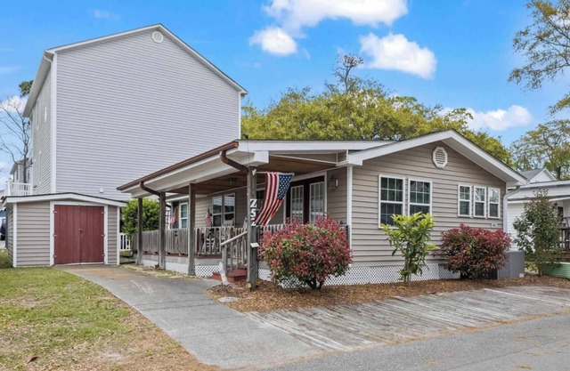 Just Listed! 3 BR, Covered Porch + Lake Views