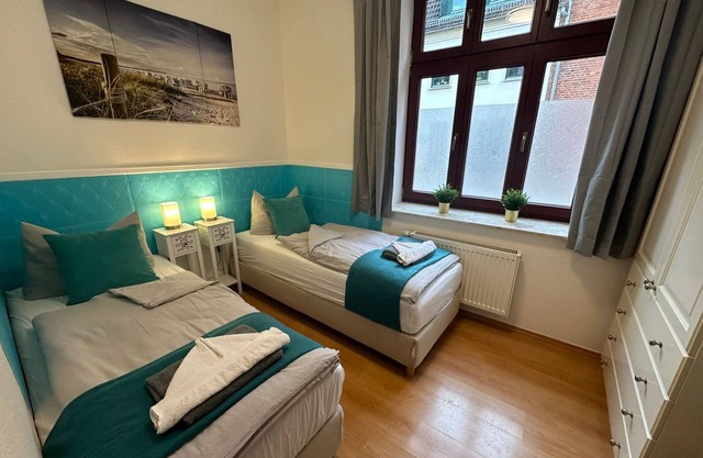 Küstengold - Ferienwohnung Küstengold - Familiebfreundlich mit Terrasse und Gem. Garten EG