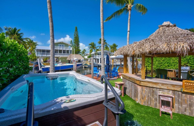 Tiki Time Hideaway. Welcome to Your 3 bedroom 2 bathroom Key Largo Canal-Front Paradise!
