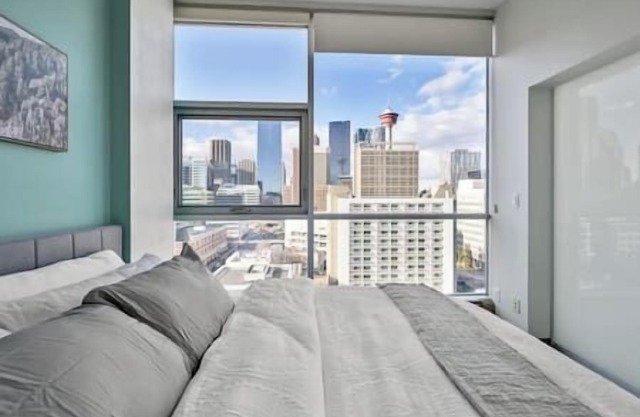 King Bed | Mins to Saddledome | AC | UG Parking