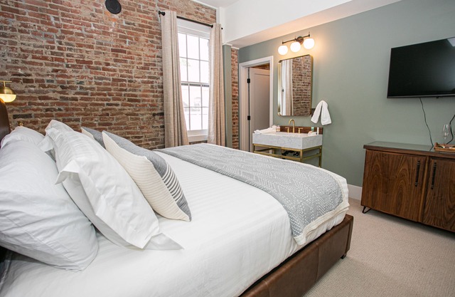 King suite at The Jacksonville Inn Features Tiled Rain Fall Shower