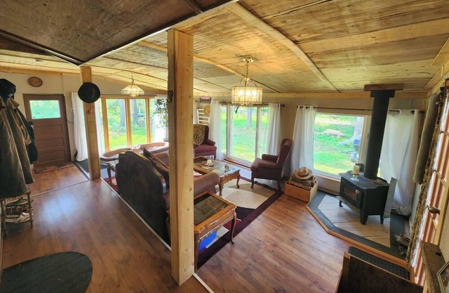 Kozy cabin in the woods with a hot tub and woodstove.