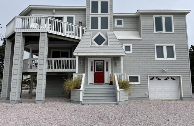 Lagoon front. Loveladies. Dock. Decks. Beach Badges. Bikes. Ping Pong table. Foosball..