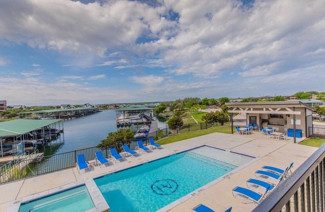 Lake front Condo 2BD/2BA w/ pool, hot tub, fire pit, gas grills, gym, & laundry.