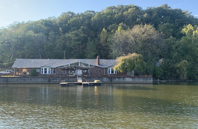 Lake Front Home with 3 steps to water, private dock, quiet cove & flat yard