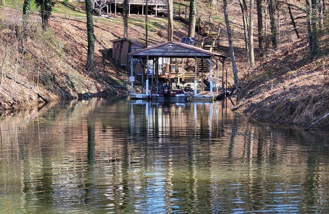 Lake Front. Large shaded deck with Covered Dock access.