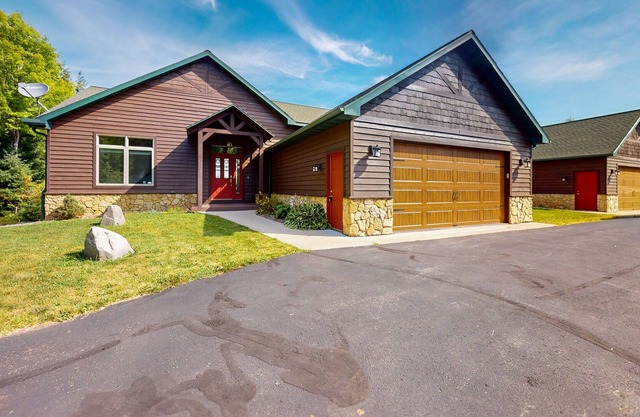 Lake-view condo with dock, pool table, grill, deck, patio, wet bar, & streaming