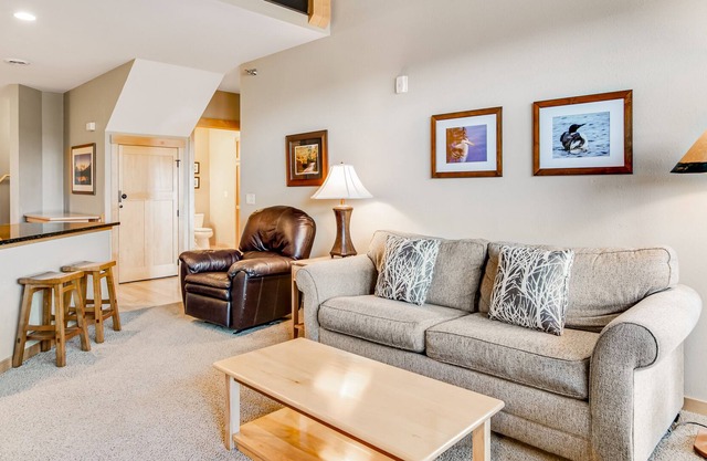 Lake-view condo with fireplace, loft, washer/dryer, pools, hot tubs, & firepit