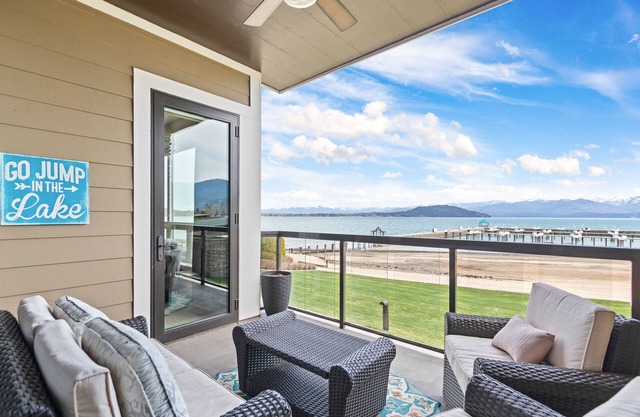 Lake view condo with WiFi, balcony, fireplace, & shared pool/hot tub/grills