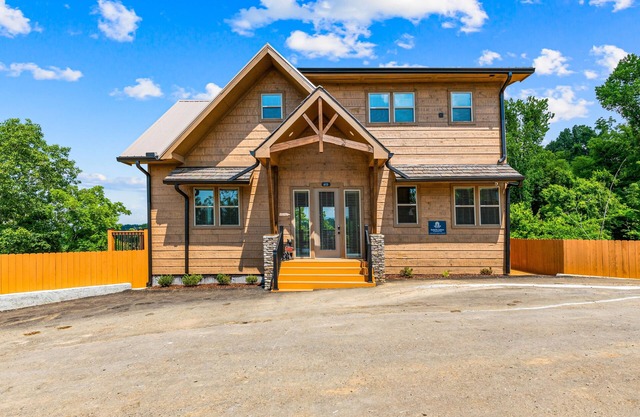Lake view home w/ 2 decks, hot tub, games, & theater + free attraction tickets