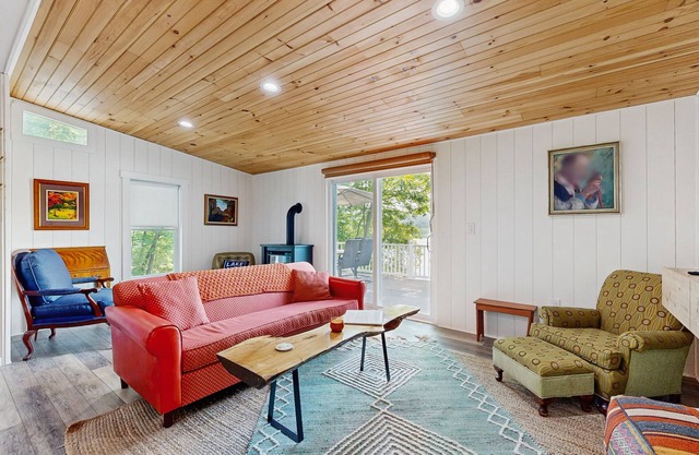 Lake-view home with private water access, dock, 2 kayaks, deck, & fireplaces