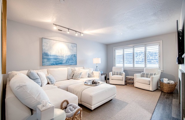 Lakefront condo with mountain views, pool, balcony, grill, fireplace, streaming