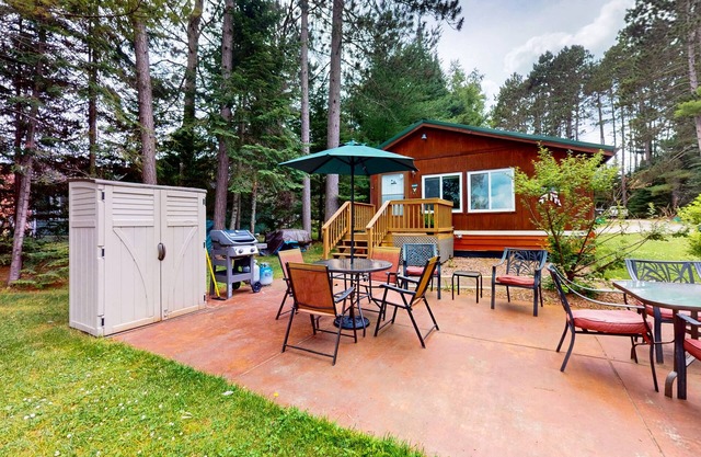 Lakefront cottage w/ a dock, shared, furnished patio, firepit, & a paddleboat