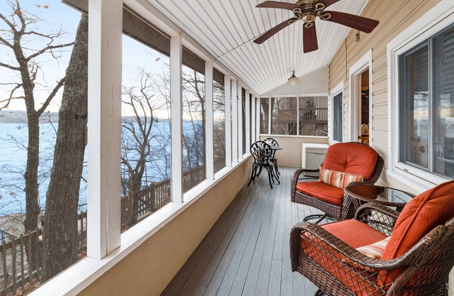 Lakefront getaway with a private dock, full kitchen, sunroom, & deck