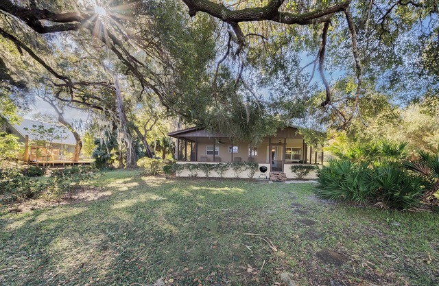 Lakefront home on Lake Kerr near Salt Springs with large porch and great yard