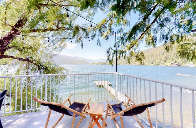 Lakefront home with dock, fireplace, washer/dryer, and mountain views - dogs OK