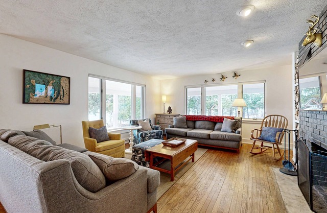 Lakefront home w/ large yard, sandy beach area, dock, & WIFI, near golf & trails