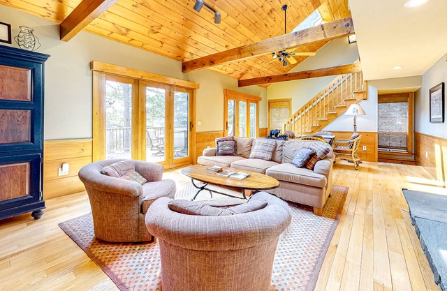Lakefront home with a private beach, dock, grill, deck, W/D, and AC