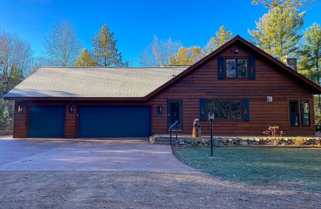 Lakefront home with game rooms, dock, kayaks, private beach, fireplace, firepit