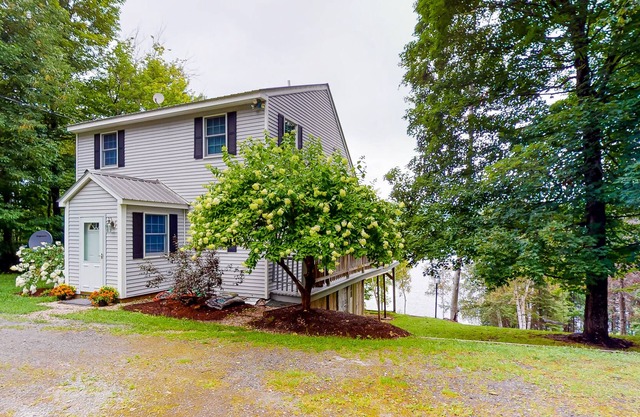 Lakefront home with private dock, deck, grill, & great view