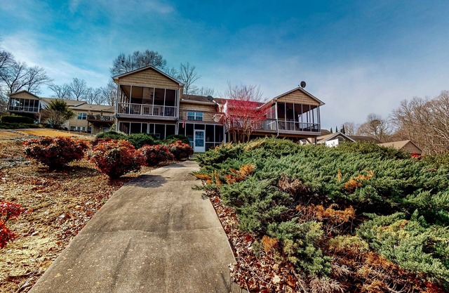 Lakefront home with private dock, boat lift, screened porches, deck, grill, W/D