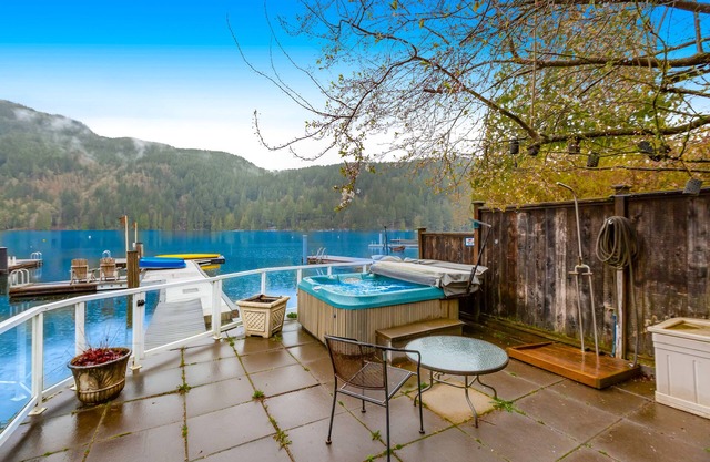 Lakefront home with stunning view, hot tub, dock, decks, firepit & rec room